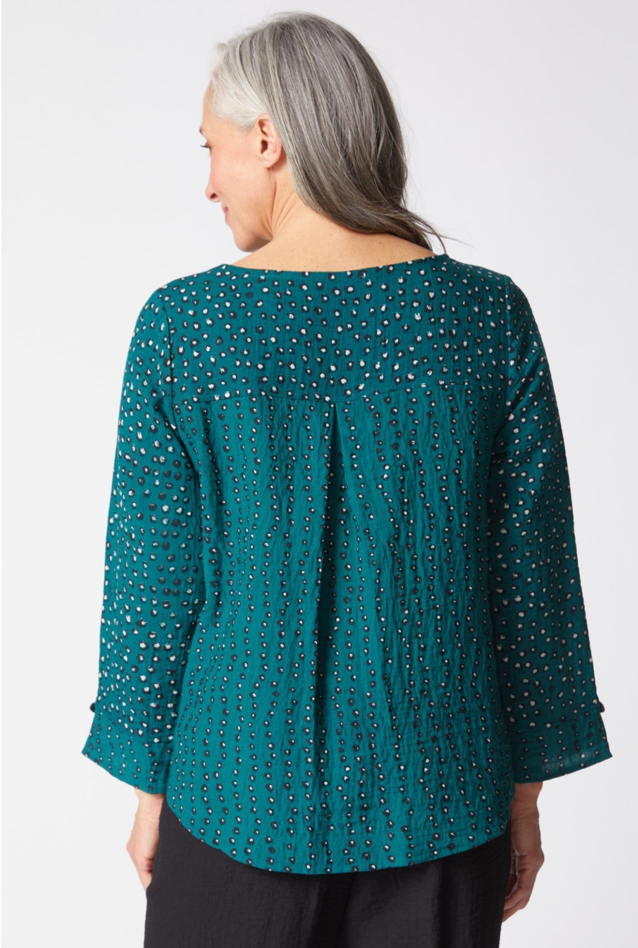 Woman wearing a teal blouse with a subtle pattern on a white background. Habitat designs for real women leading real lives. We prioritize comfort, fit and detail to create unique, modern looks that complement your body and sense of self.
Victoria Susan Wearable Art is a clothing boutique for women in Downtown Camden SC. 