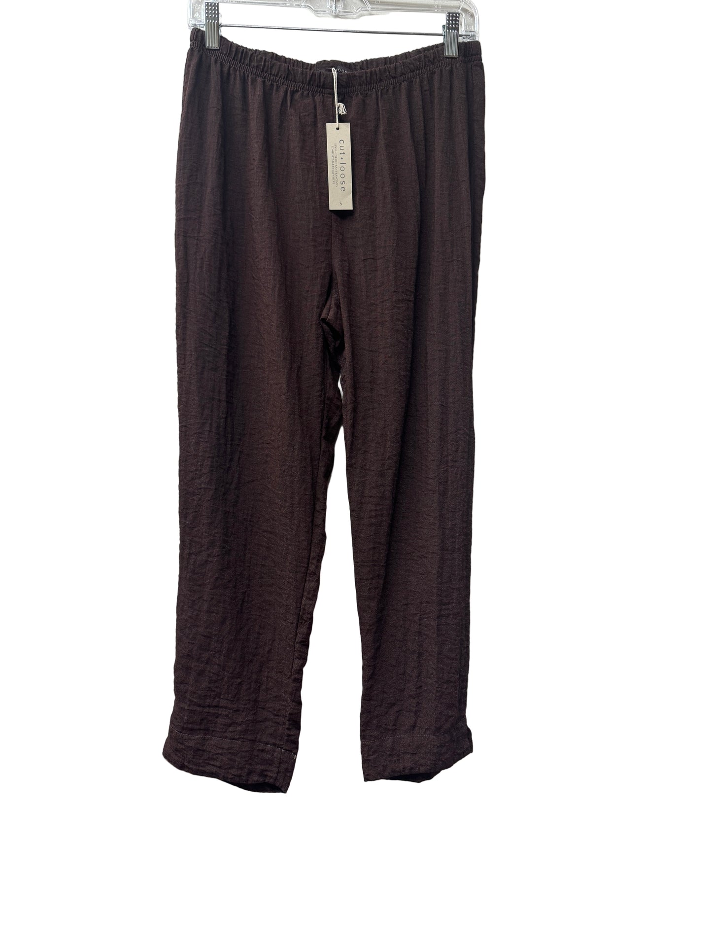 Pair of brown pants on a white surface