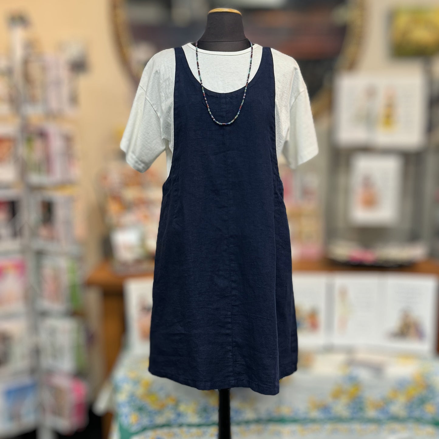 The Linen Dress Overalls by Cut-Loose in Nightsky feature handy pockets for optimal organization on-the-go. This fun and breathable dress is inspired by timeless overalls and is designed with scoop necklines in both front and back. Linen. Made in USA. Victoria Susan Wearable Art is a ladies clothing boutique in Camden, SC.