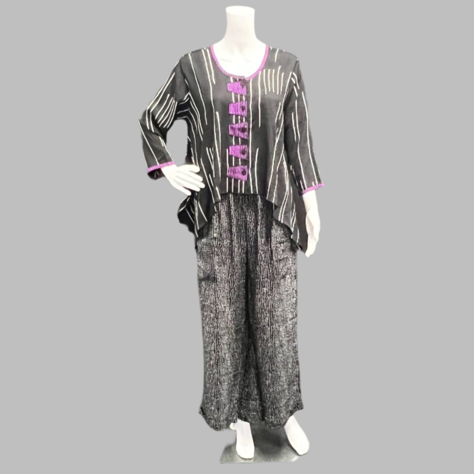 Iguana : Wear your art on your sleeve. Hand Batiked so no two pieces are alike.  Iguana is the epitome of Art to Wear and Victoria Susan Wearable Art is thrilled to carry these amazing pieces.  Victoria Susan Wearable Art is a womens clothing store in Camden sc. 