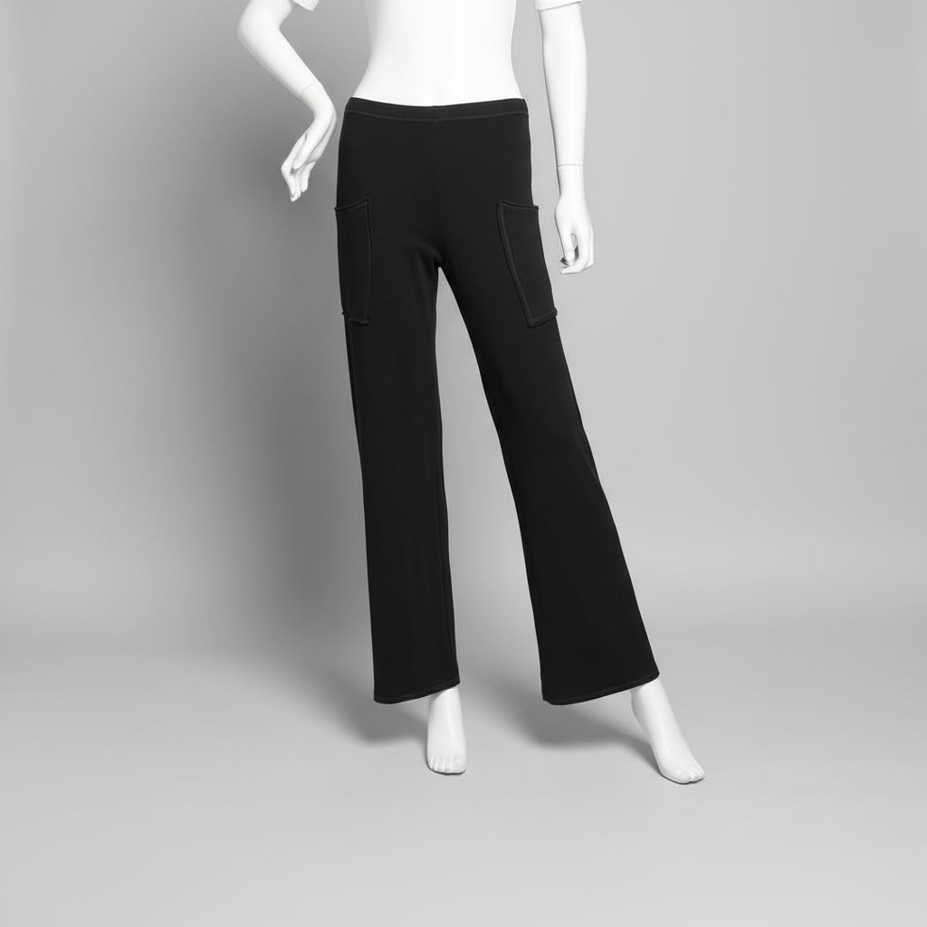 Mannequin wearing black pants against a plain background