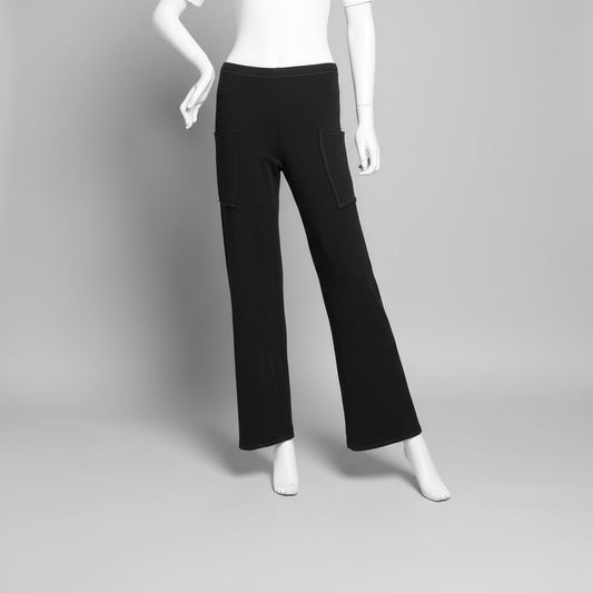 Mannequin wearing black pants against a plain background