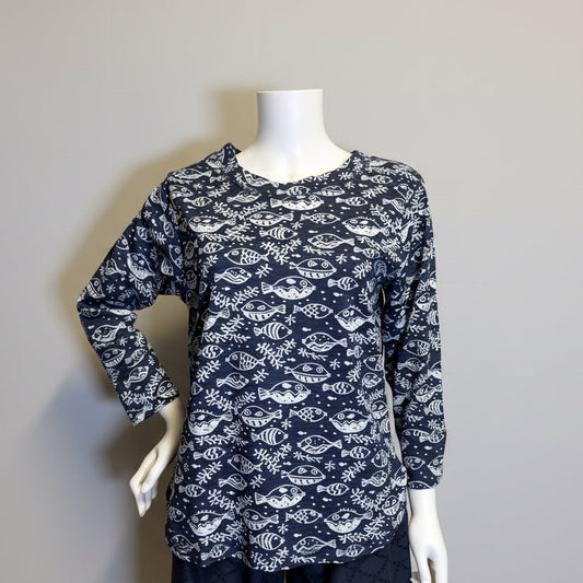 Navy blue patterned top and pants on a mannequin against a beige background