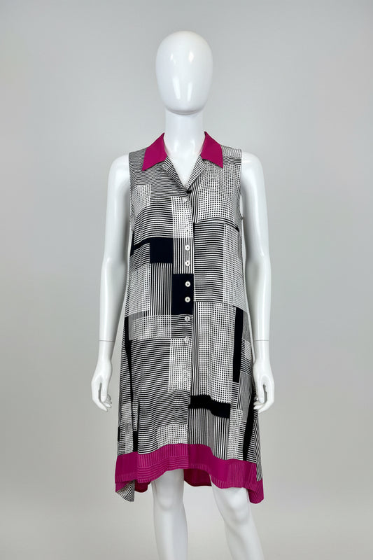 Plaid dress with pink accents on a mannequin against a beige background