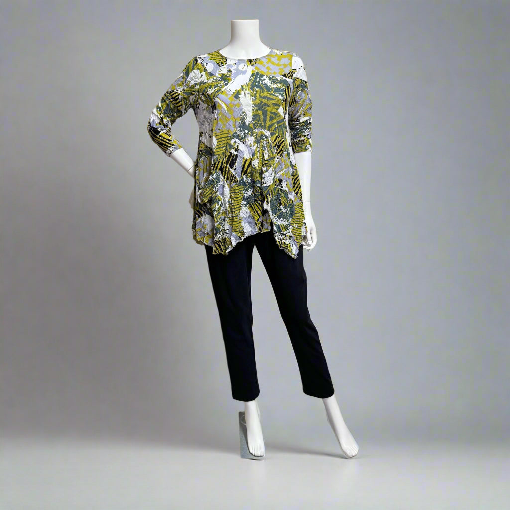 Mannequin at Victoria Susan in Camden SC wearing an Iris patterned top by Chalet Et Ceci and black pants. 