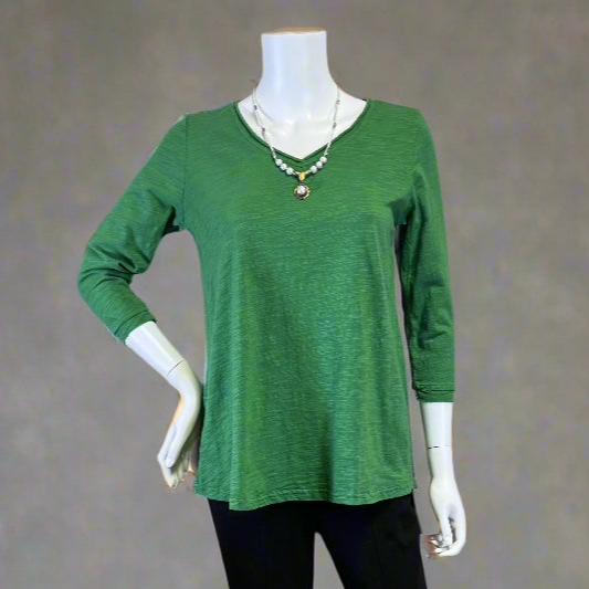 Green 3/4 sleeve top by Kleen on a mannequin against a gray background at Victoria Susan in Camden SC