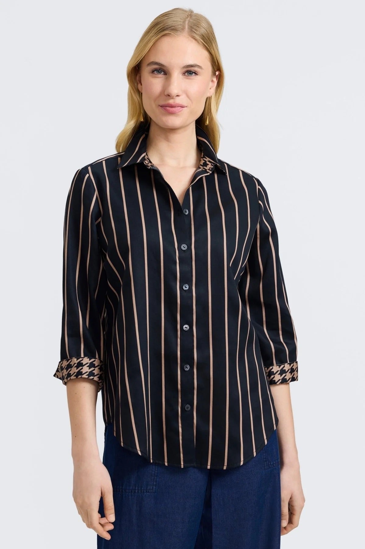 Woman wearing a black and almond striped shirt by Foxcroft on a white background at Victoria Susan Wearable Art in Camden SC