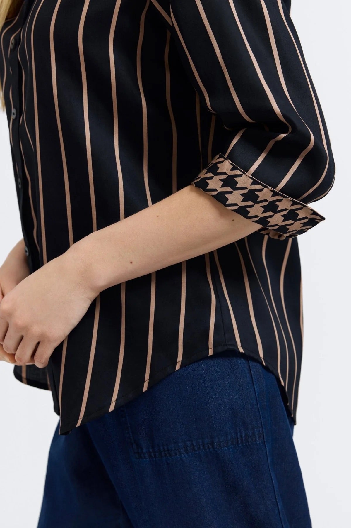 Close up of Woman wearing a black and almond striped shirt by Foxcroft on a white background at Victoria Susan Wearable Art in Camden SC