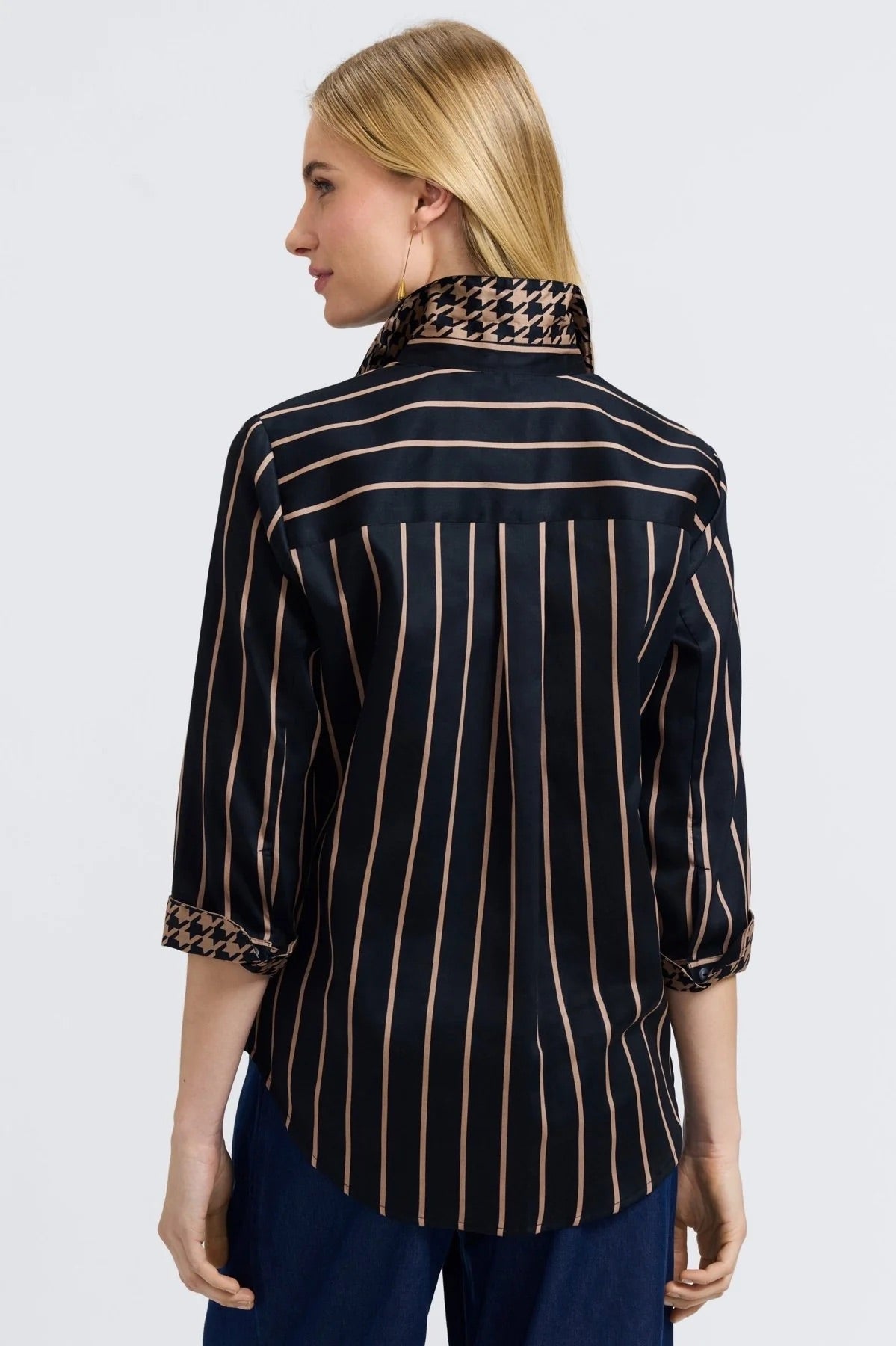 Woman wearing a black and almond striped shirt by Foxcroft on a white background at Victoria Susan Wearable Art in Camden SC