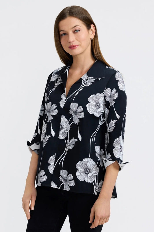 Woman wearing a black floral blouse by Foxcroft  on a white background at Victoria Susan in Camden SC 