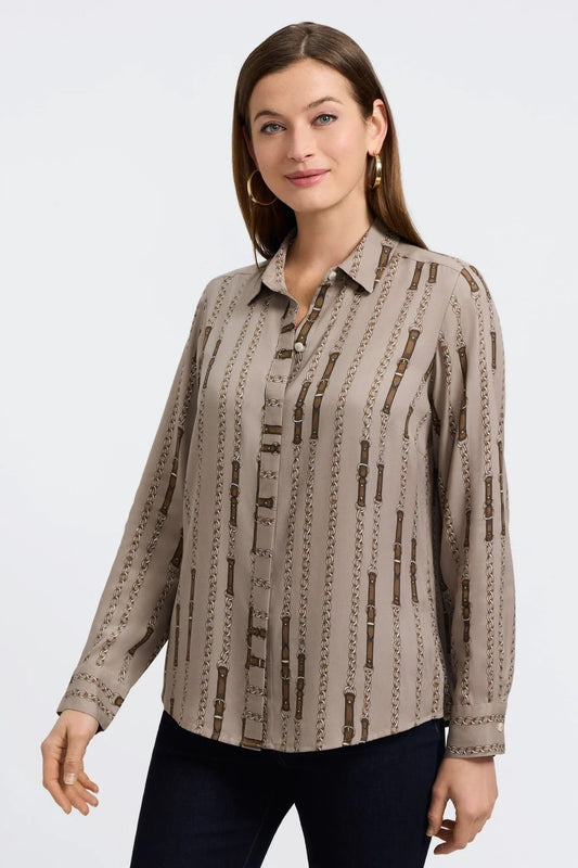 Woman wearing a patterned blouse by Foxcroft against a plain background at Victoria Susan Wearable Art in Camden SC