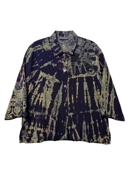 A short-sleeve button-up shirt with a dark navy and olive green tie-dye pattern, displayed flat against a white background.