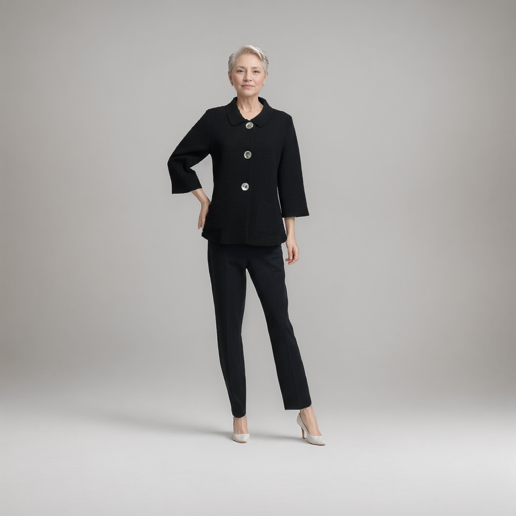 Woman wearing a black suit with a gray background at Victoria Susan in Camden SC 